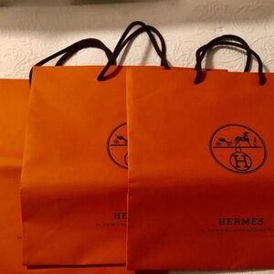 3 orange Hermes scarf shopping bags